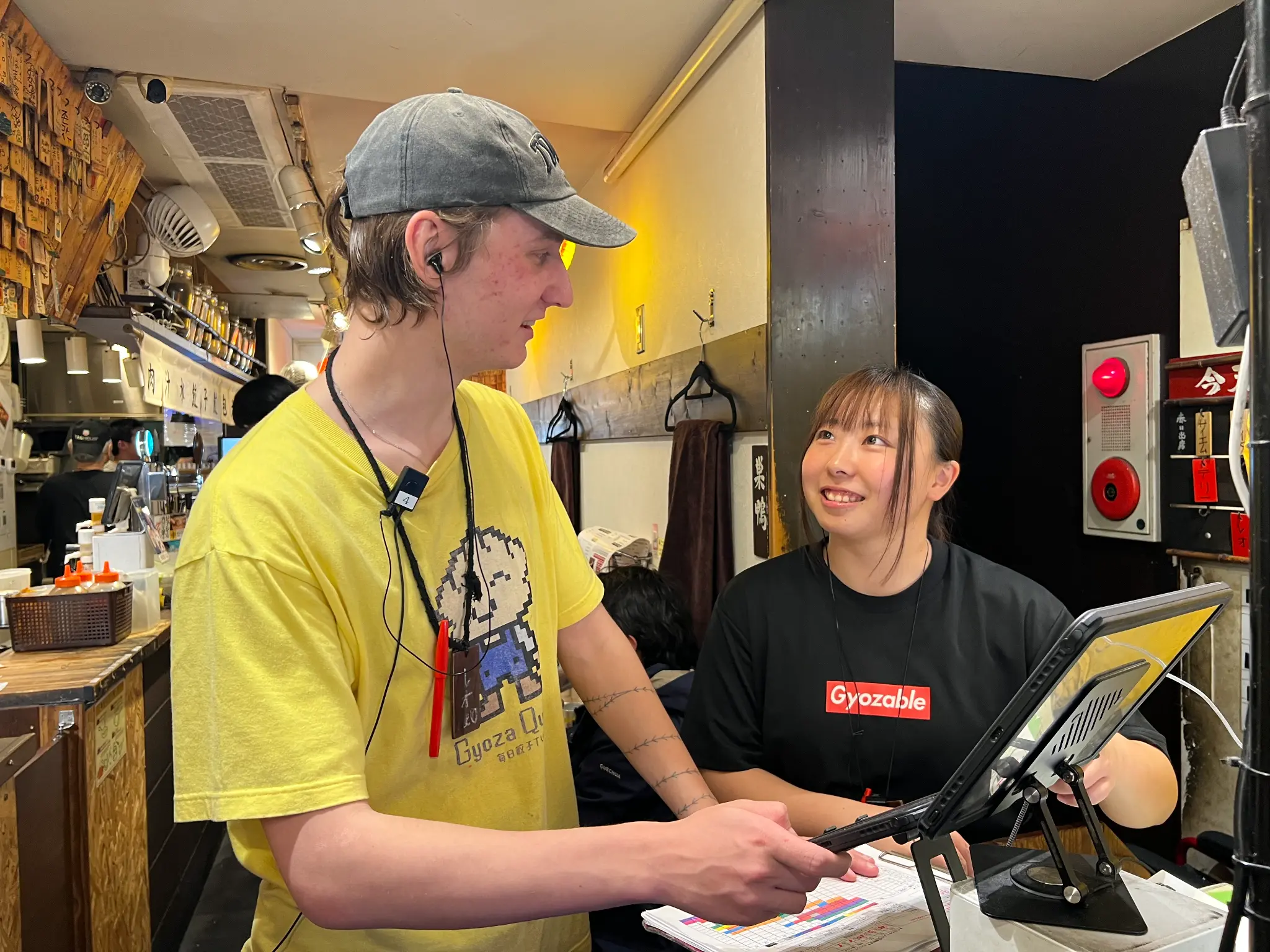 On-the-job coaching between Gyoupao restaurant staff members