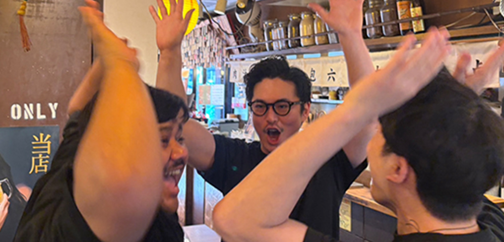 Restaurant staff celebrating teamwork after customer-service training