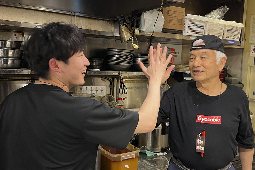 Gyoupao staff members practicing teamwork in the restaurant kitchen